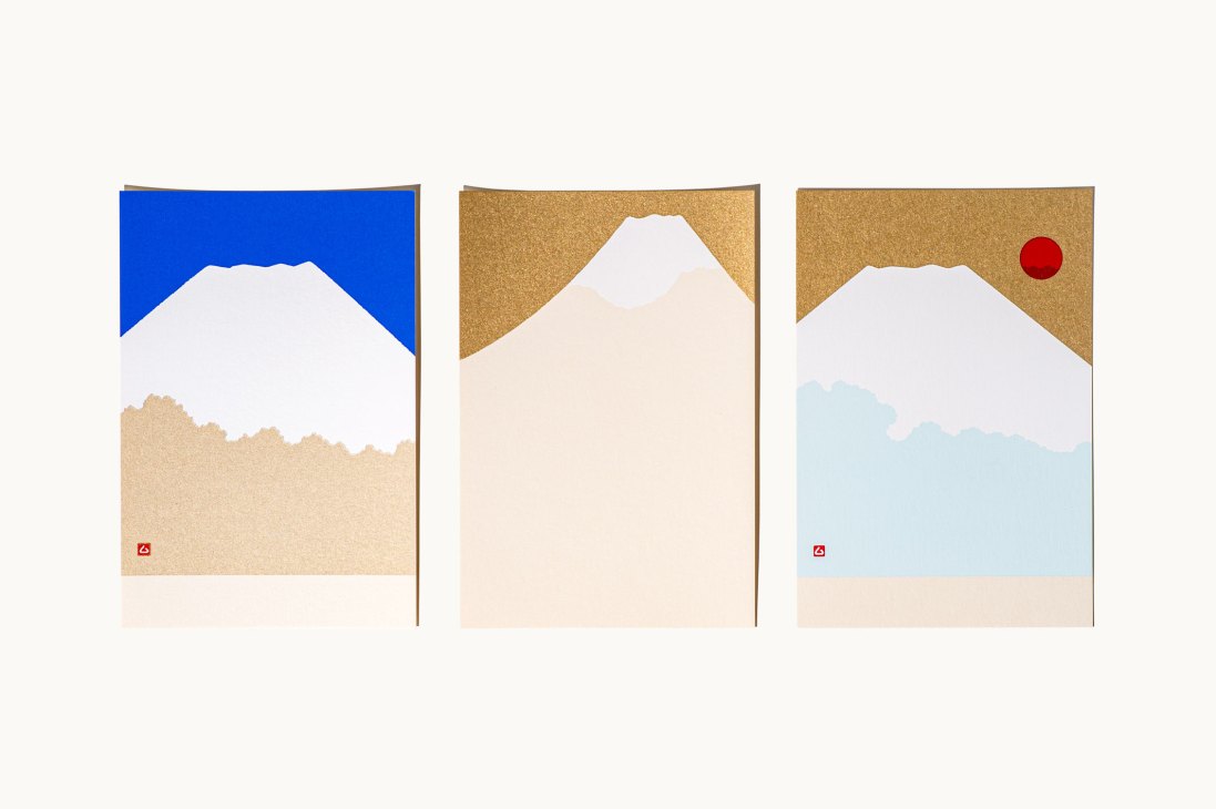 Three silkscreen-printed postcards from Kyukyodo featuring stylized Japanese landscape designs with mountains