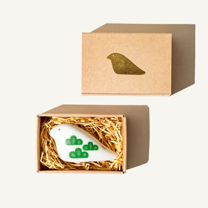 Ceramic incense holder shaped like a pigeon (hato) nestled in natural straw packaging