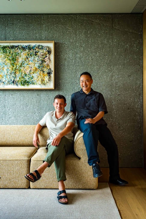 Portrait of Frederik Werner and Keiji Ashizawa standing together in the hotel