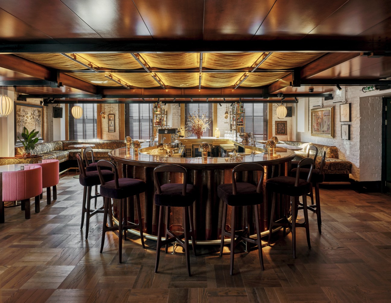 Elegant bar area featuring leather upholstery and onyx surfaces in the Battens Bar at Koko