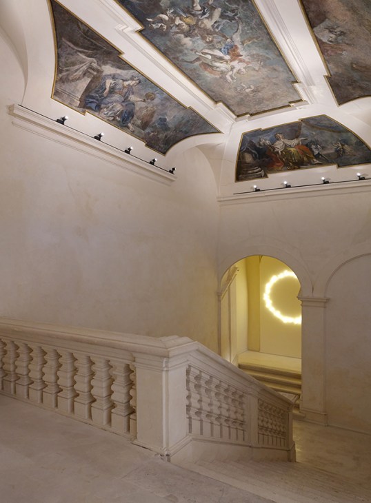 Ornate baroque ceiling frescoes and white stone staircase with decorative balustrade in restored Italian palace interior Palazzo Ardinghelli