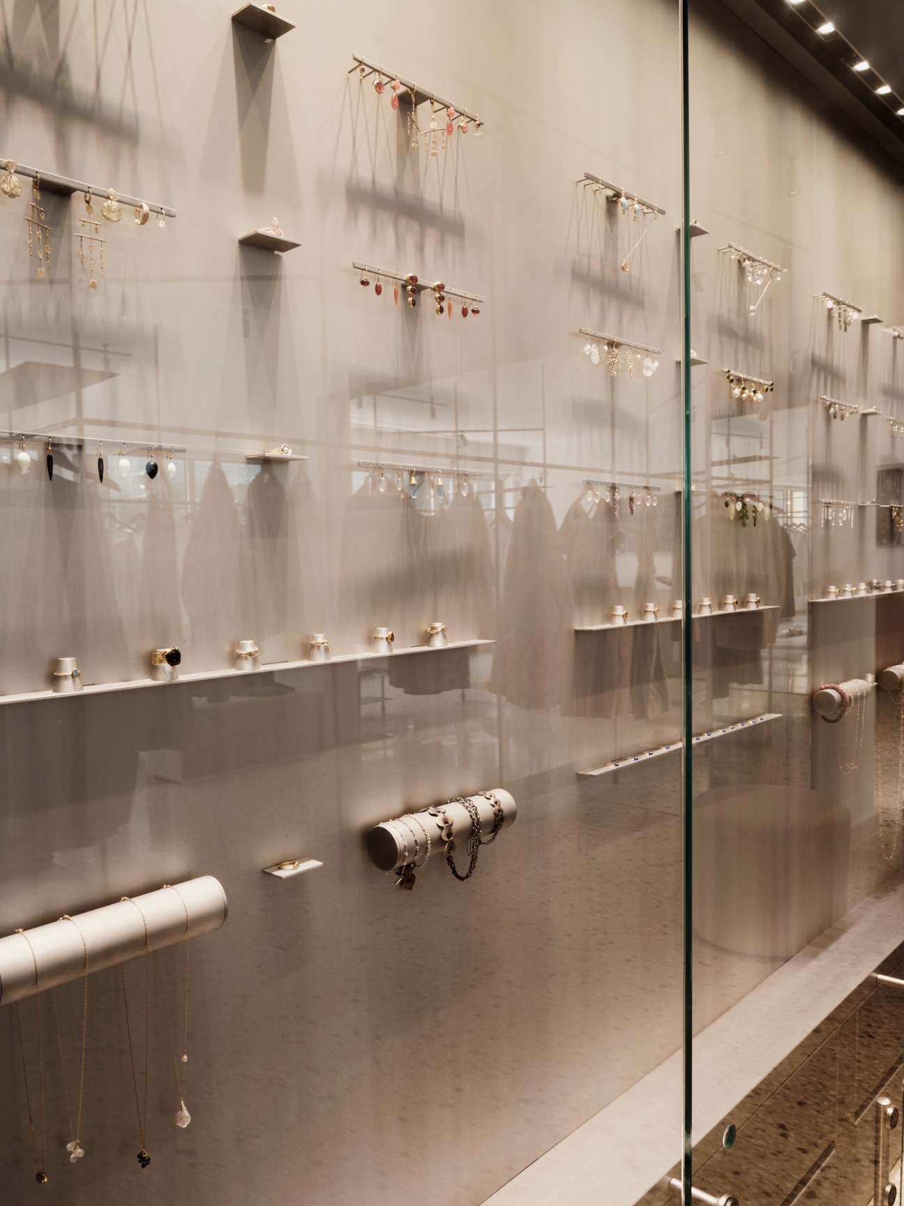 Glass jewellery display cabinets with vertical hanging displays and shelved rings