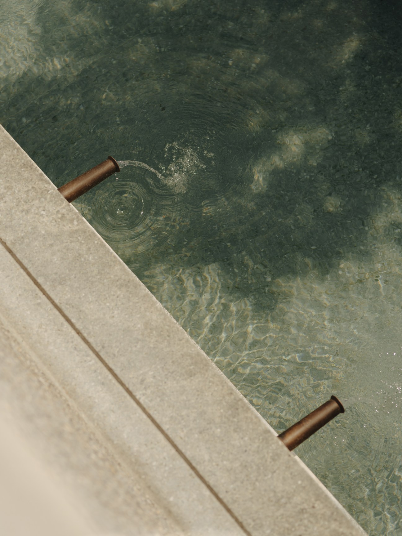 Steam rising from geothermal water source in Baden showing the natural hot springs