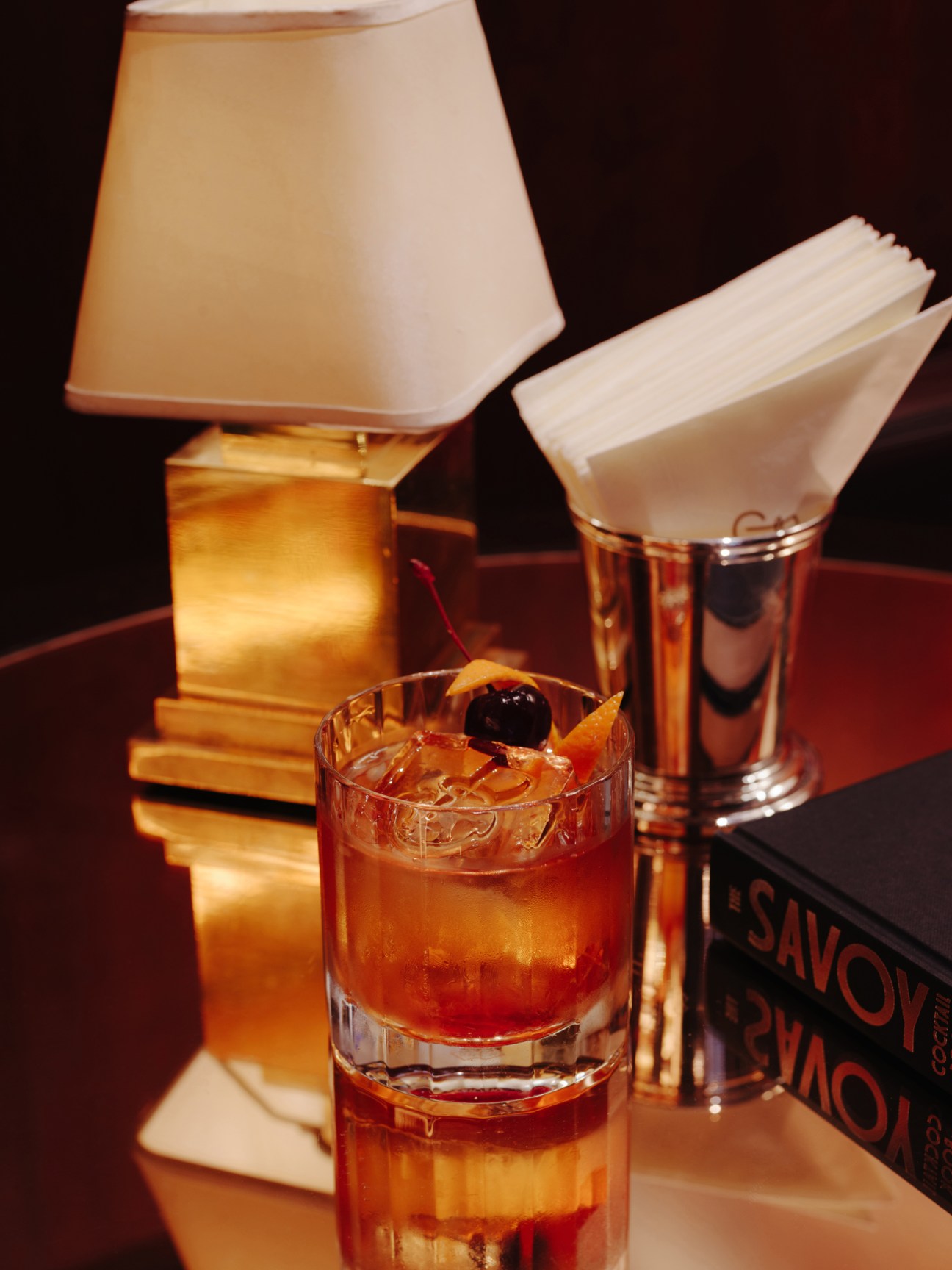 Giovanni Dellaglio preparing an old fashioned cocktail with bourbon at London's Beaumont Hotel