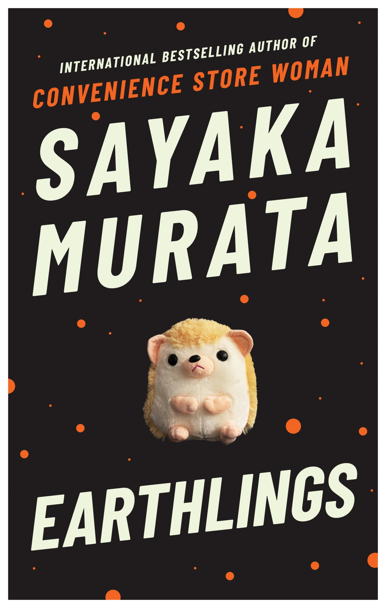 Book cover for "Earthlings" by Sayaka Murata featuring a cute round creature with orange dots on black background