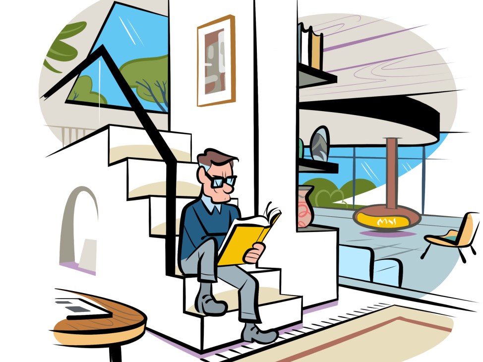Man in glasses and sweater reading yellow book while sitting on white stairs in modern interior