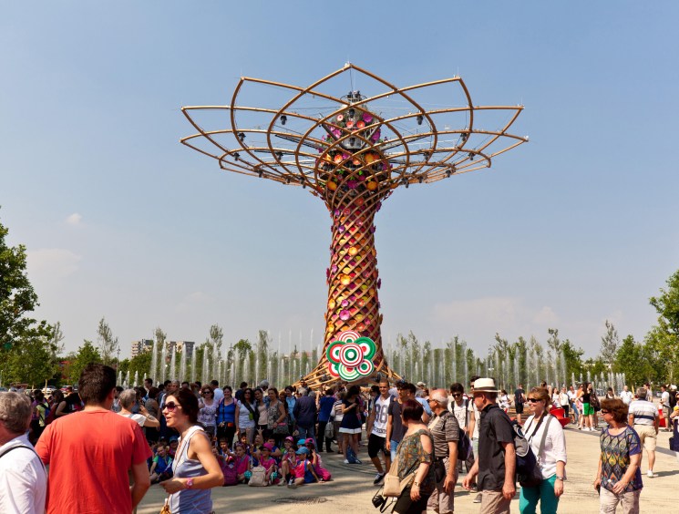 Crowds gather around the Tree of Life, a large sculptural installation with geometric canopy at Milan Expo 2015