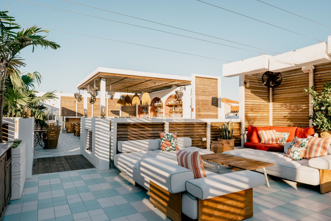 Rooftop terrace at Esmé Miami Beach with outdoor seating, pool and modern design