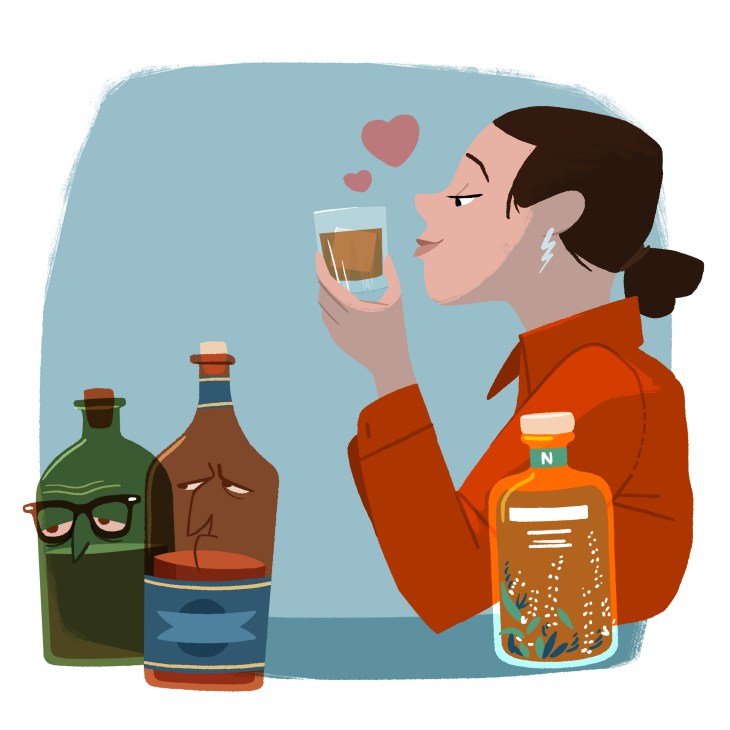 Illustration of a woman in an orange jacket holding a glass of whisky with bottles beside her and hearts floating above.
