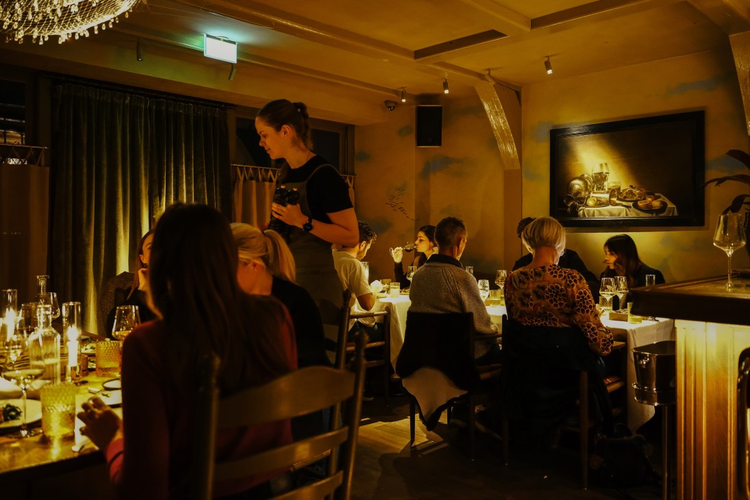 Restaurant table setting with elegant dinnerware and candlelit atmosphere