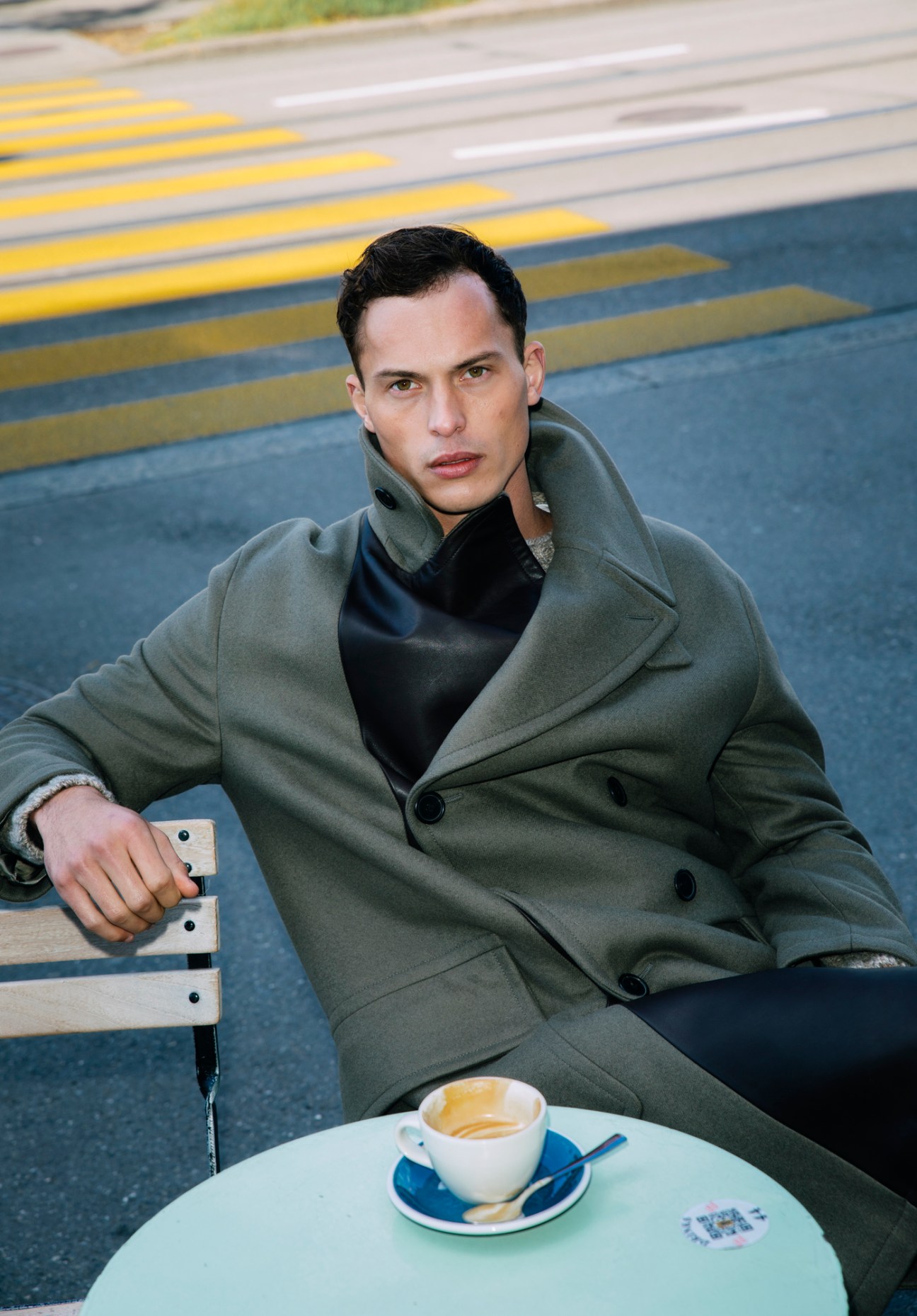 Model in luxury outerwear - Hermès coat paired with Howlin' jumper from Matchesfashion