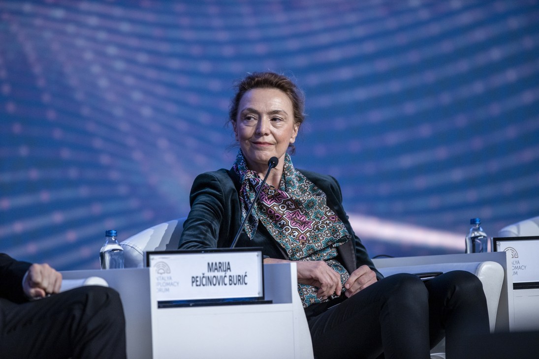 Marija Pejcinovic Buric sitting at diplomatic forum panel with microphone and nameplate