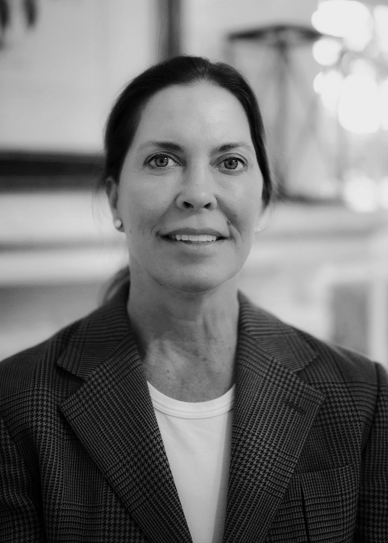 Hanna Struever in a black and white portrait photograph wearing a checkered blazer