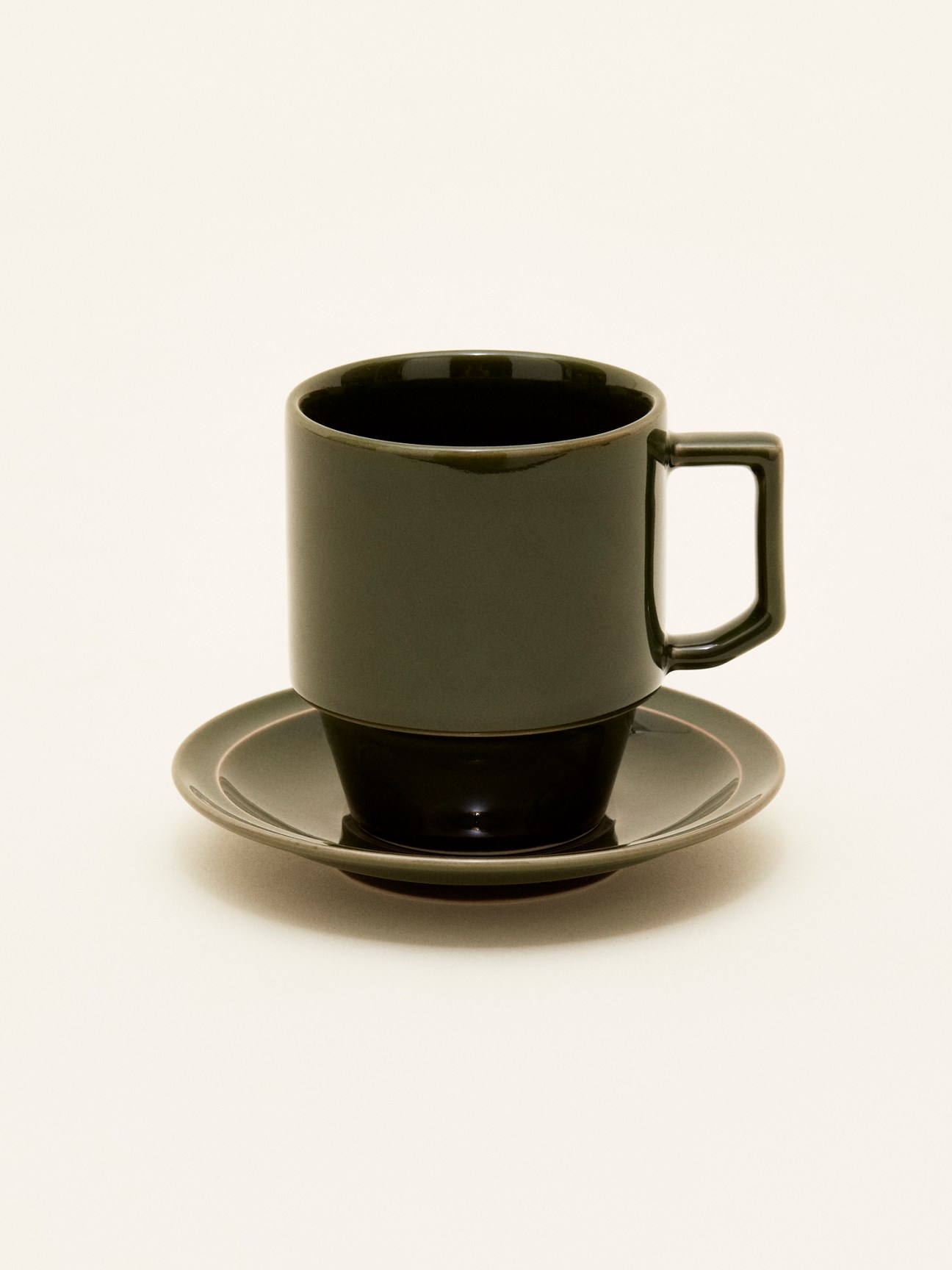Hasami x Monocle large mug set with olive-grey cup and saucer on neutral background.