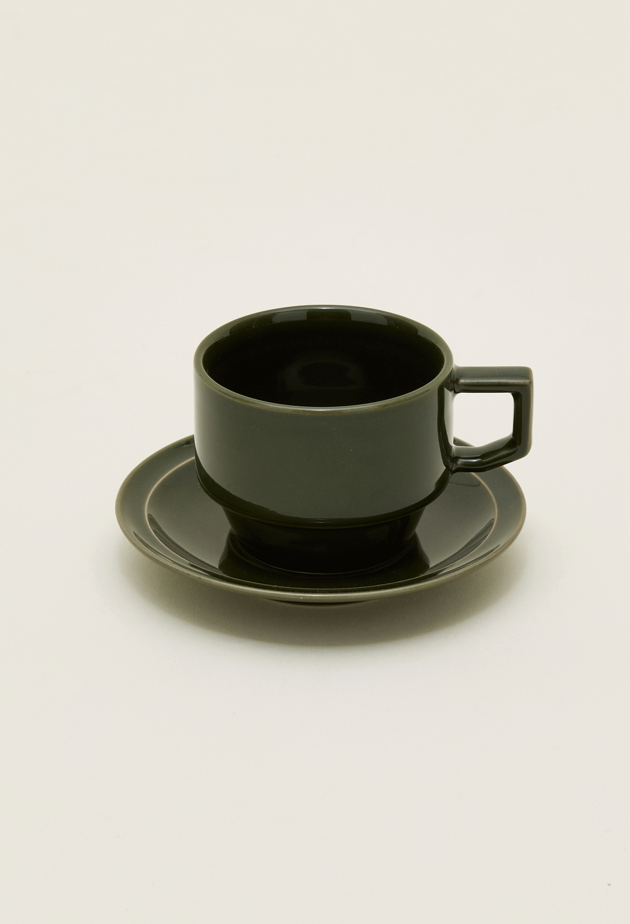 Dark olive green ceramic coffee cup and saucer set with modern minimalist design