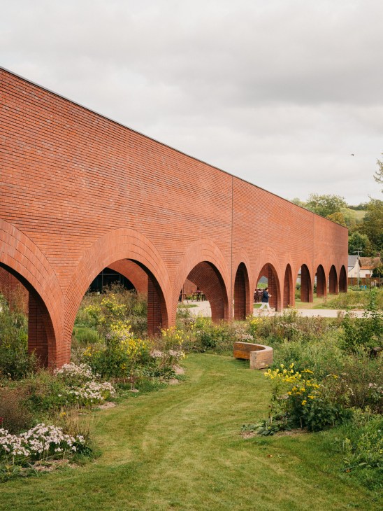 Exterior view of the red-brick Maroquinerie de Louviers building designed by architect Lina Ghotmeh