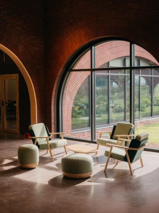 Wooden chair positioned by a window with natural sunlight streaming in