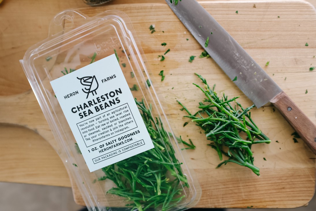 Charleston Sea Beans package with fresh samphire greens on cutting board next to knife