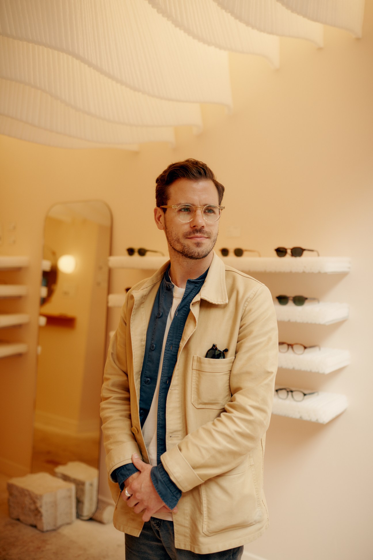 Interior of Monc eyewear shop showing wall displays of eyeglasses frames in a modern retail setting