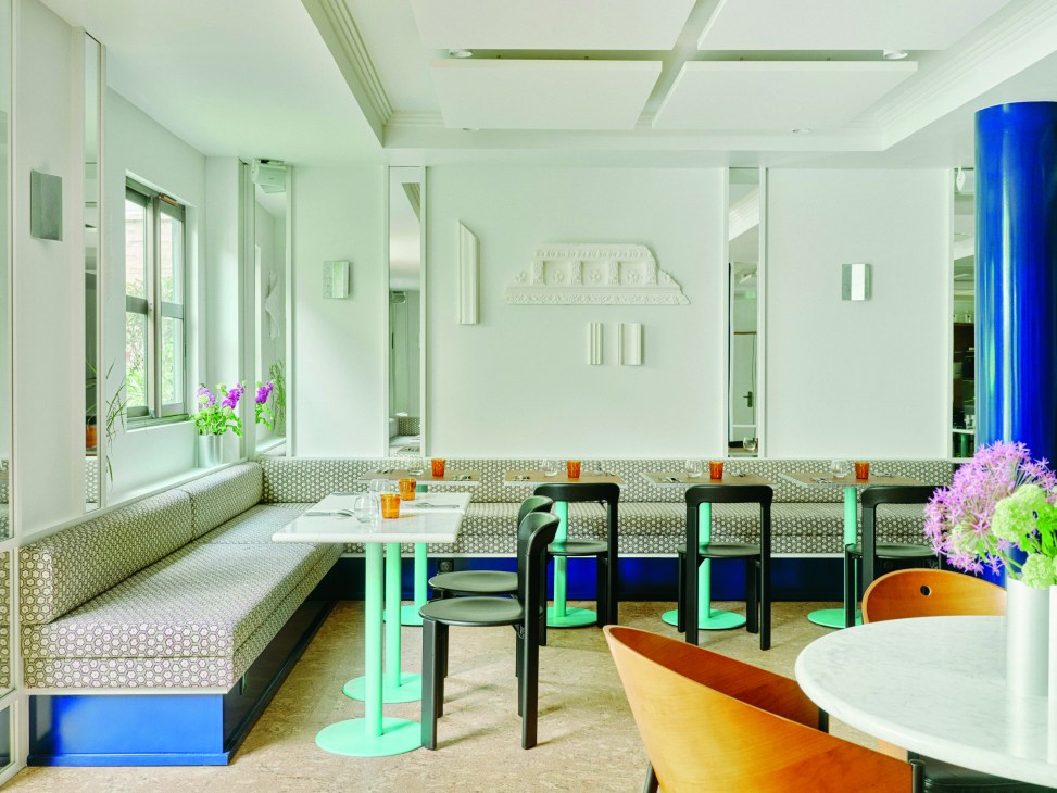 Rosalie hotel restaurant interior with mint green banquette seating, white marble tables, and modern lighting