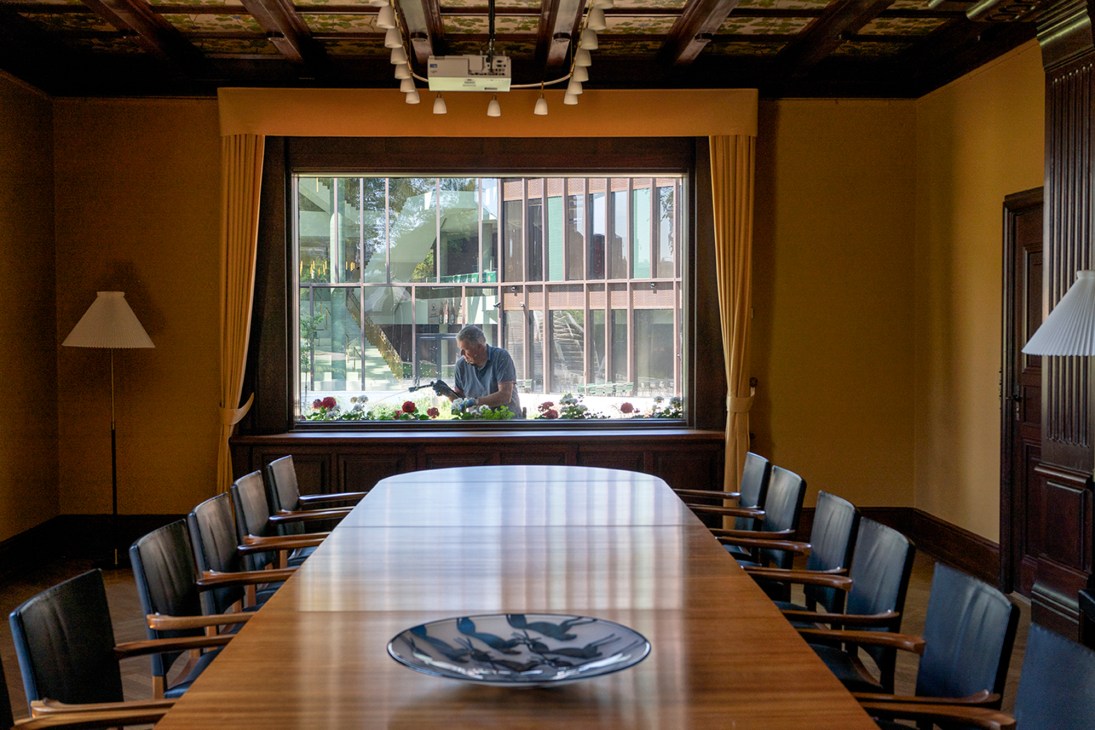 Modern meeting room with large windows overlooking garden