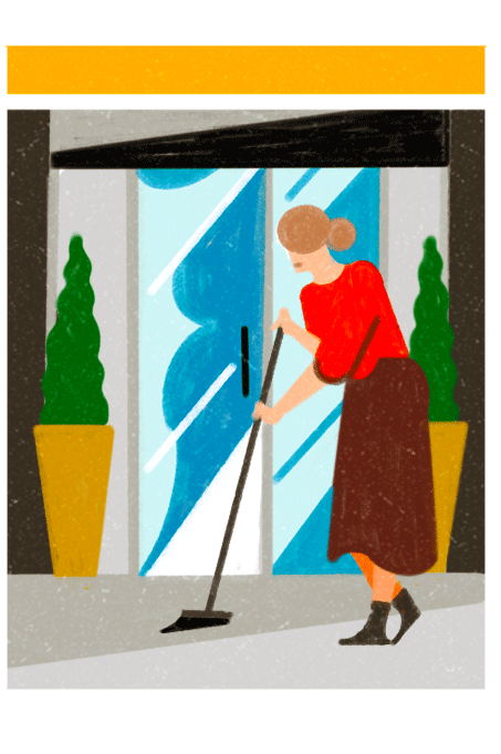 Person sweeping storefront with broom while potted plants sit nearby