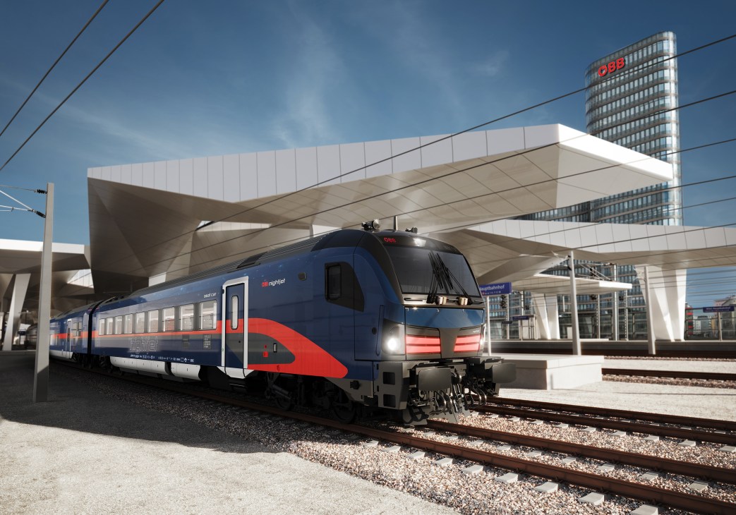 Blue and red ÖBB Nightjet train at modern station platform with glass canopy and city buildings in background