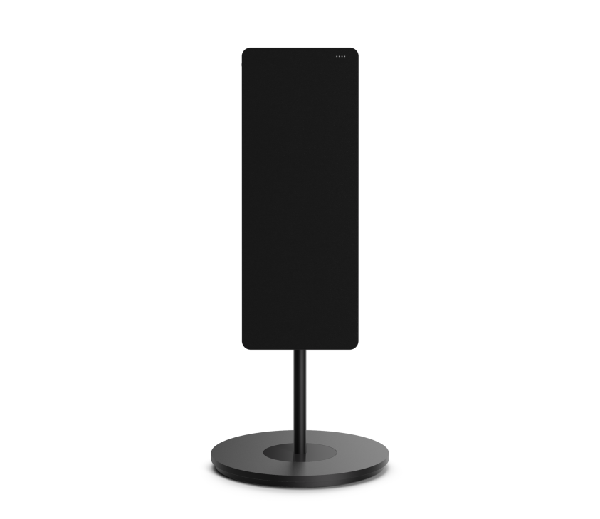 Black cylindrical speaker on round base stand against white background