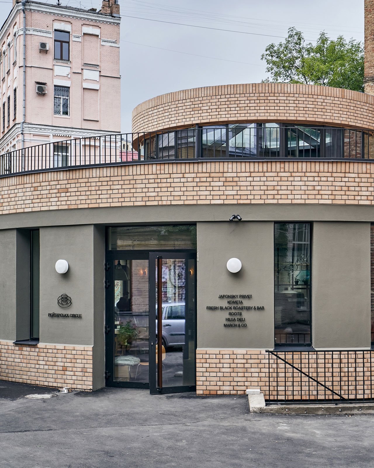 Reytarska Circle restaurant in Kyiv with distinctive circular brick building design and restored modernist facade.