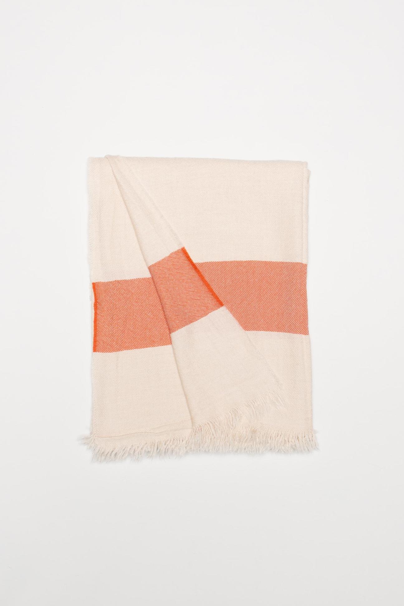 Begg & Co cashmere travel blanket in cream and coral geometric pattern with fringe detail