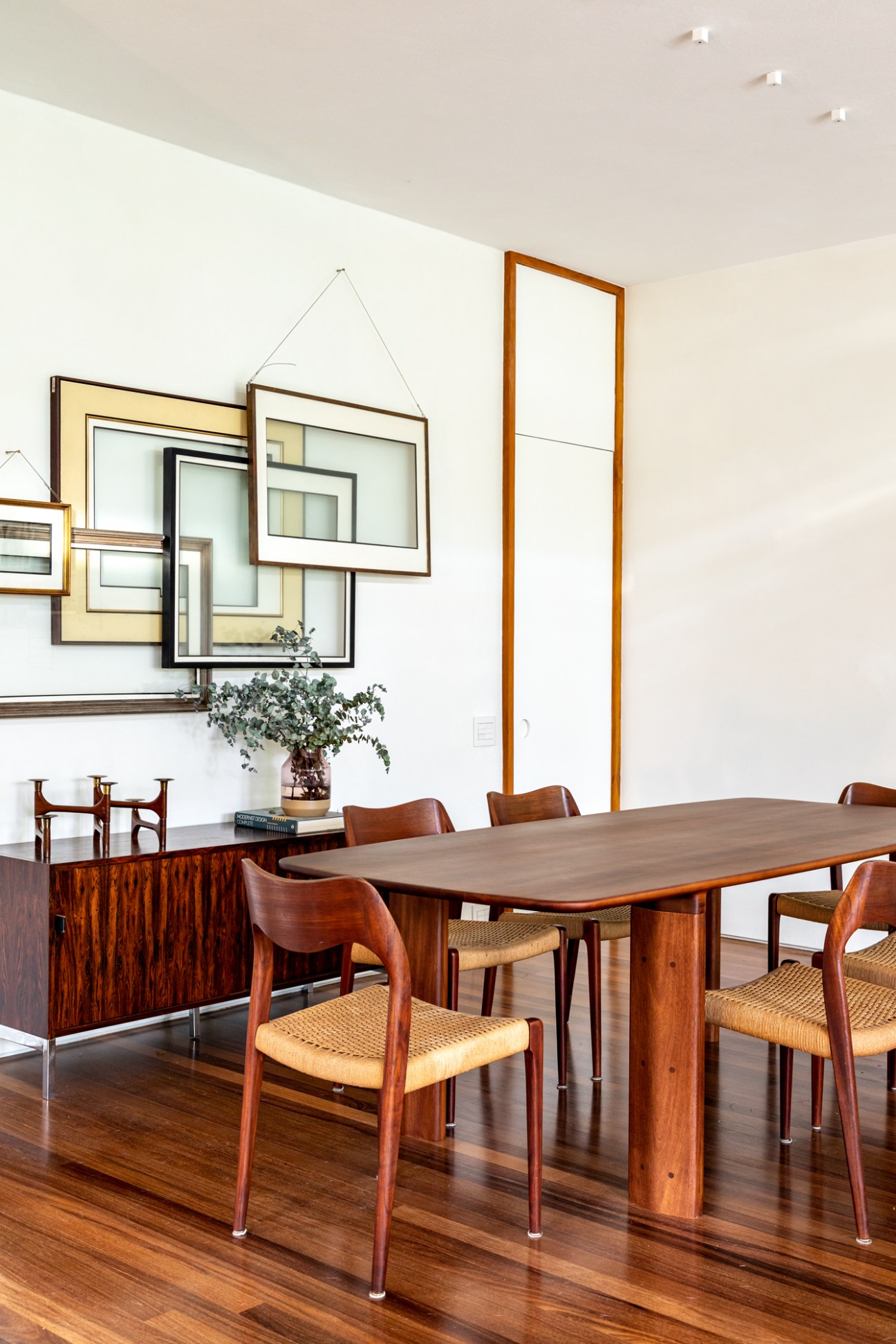 Art by Rodrigo Matheus above a Richard Schultz Knoll sideboard