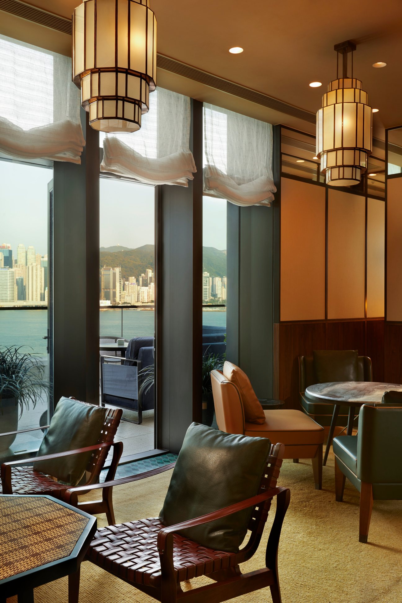 Interior of Chaat restaurant showing modern dining room with green banquette seating and warm lighting