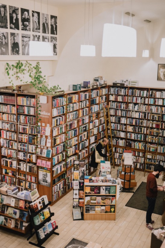 Interior of Írók Boltja bookshop showing shelves of books and literary gathering space