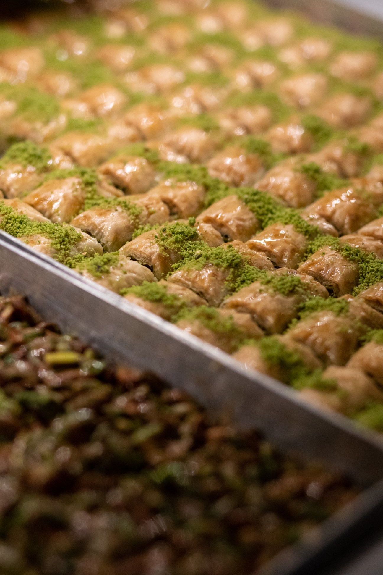 Fresh baklava pastries displayed in glass cases at Karakoy Gulluoglu