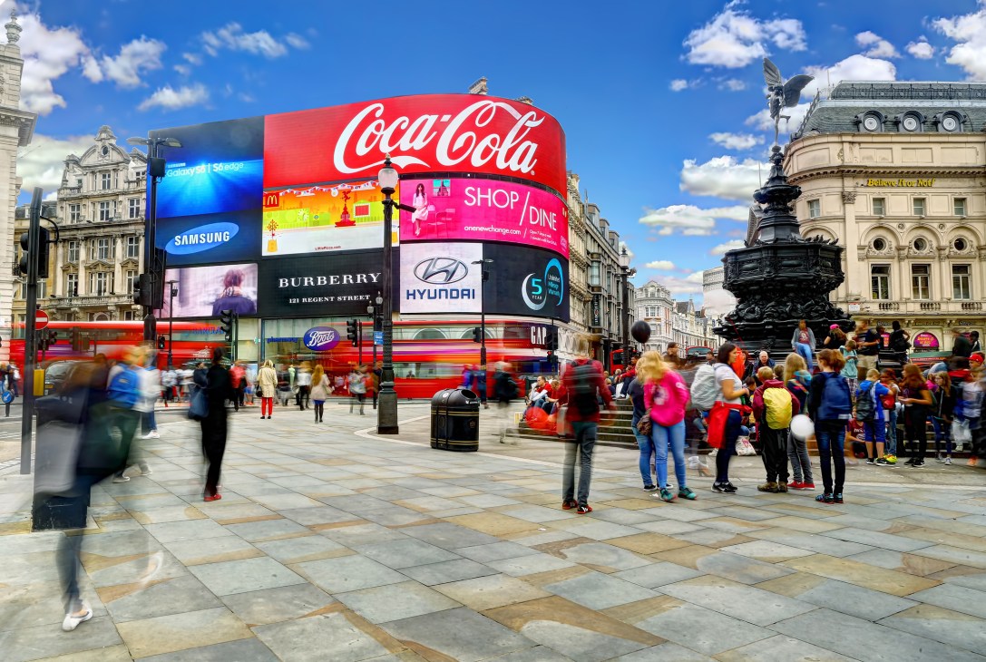 Piccadilly Circus with its famous illuminated digital billboards displaying Coca-Cola and other brand advertisements