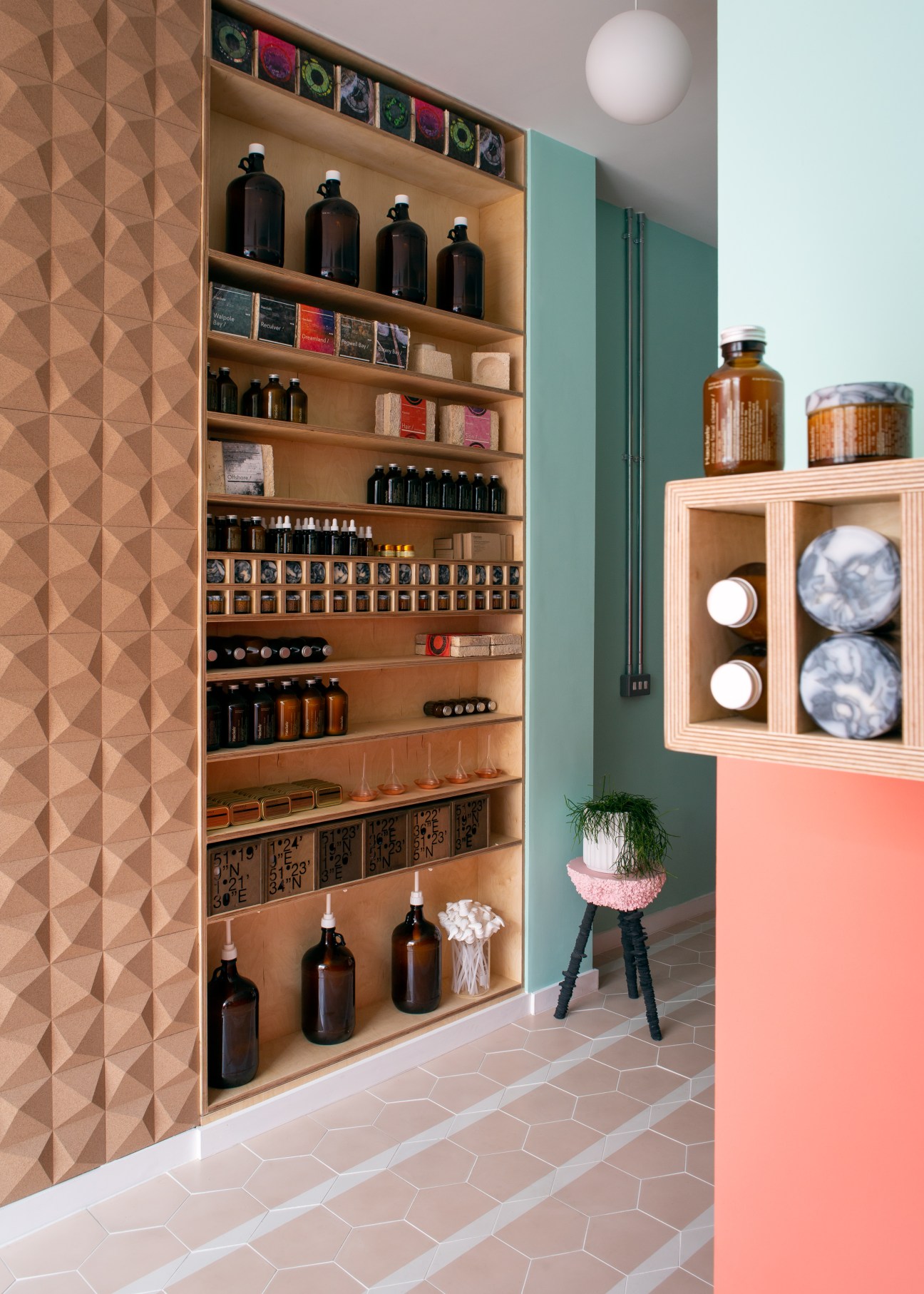 Haeckels store interior with organized shelving displaying dark bottles and beauty products in wooden fixtures