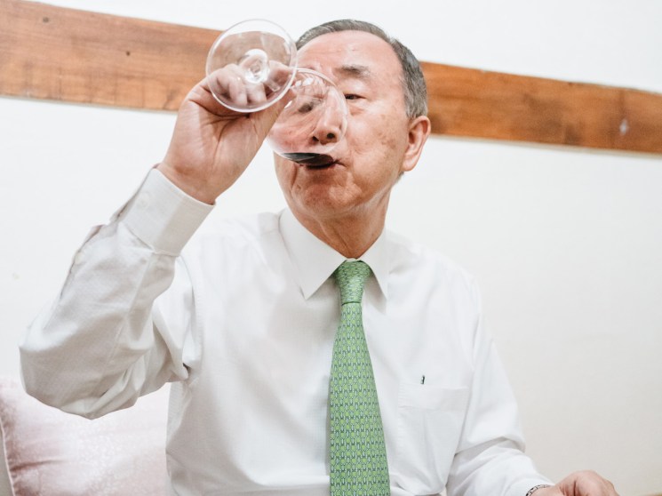 Korean gentleman drinking wine from a wine glass