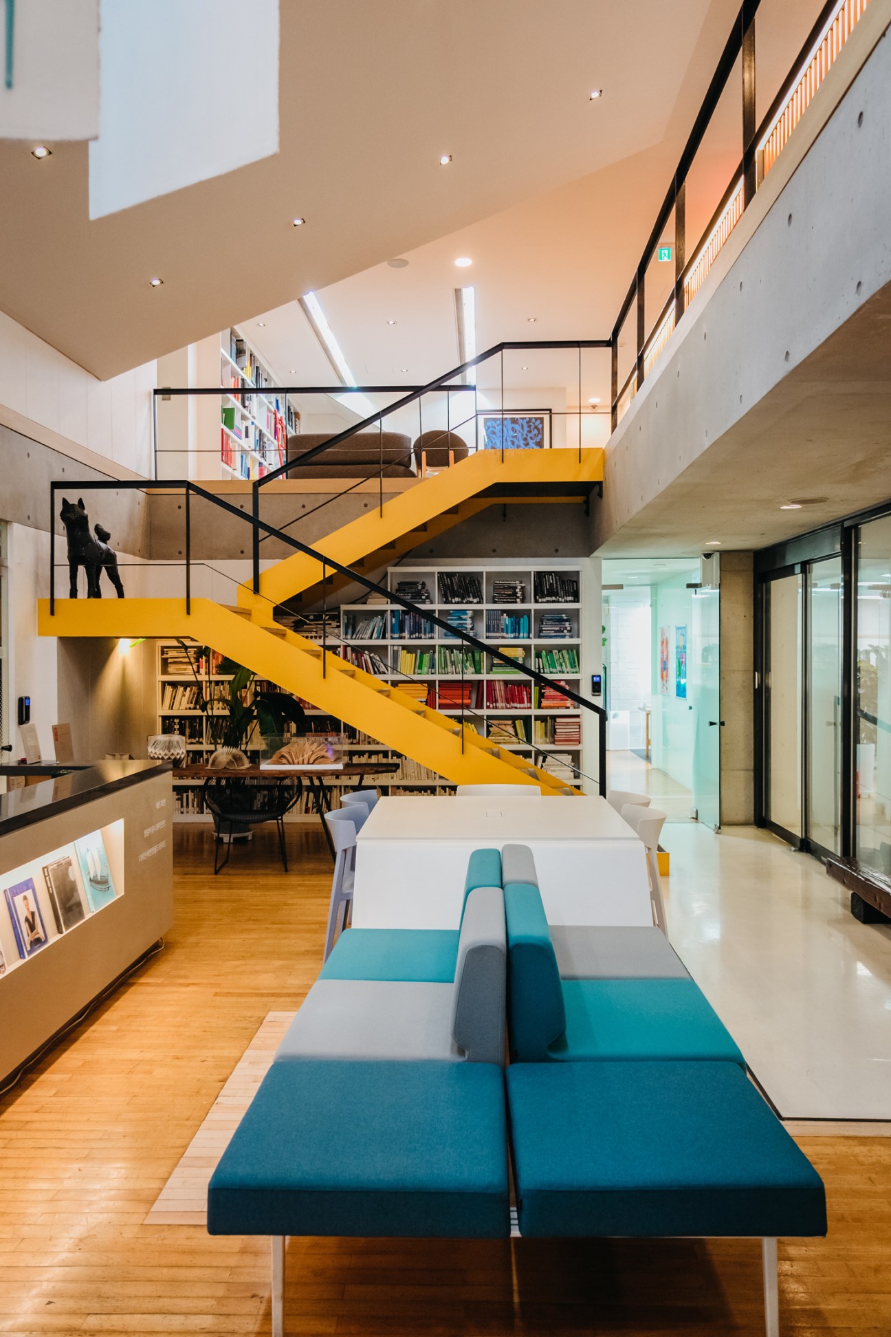Lee Young-hye sitting in her design office surrounded by books and magazines