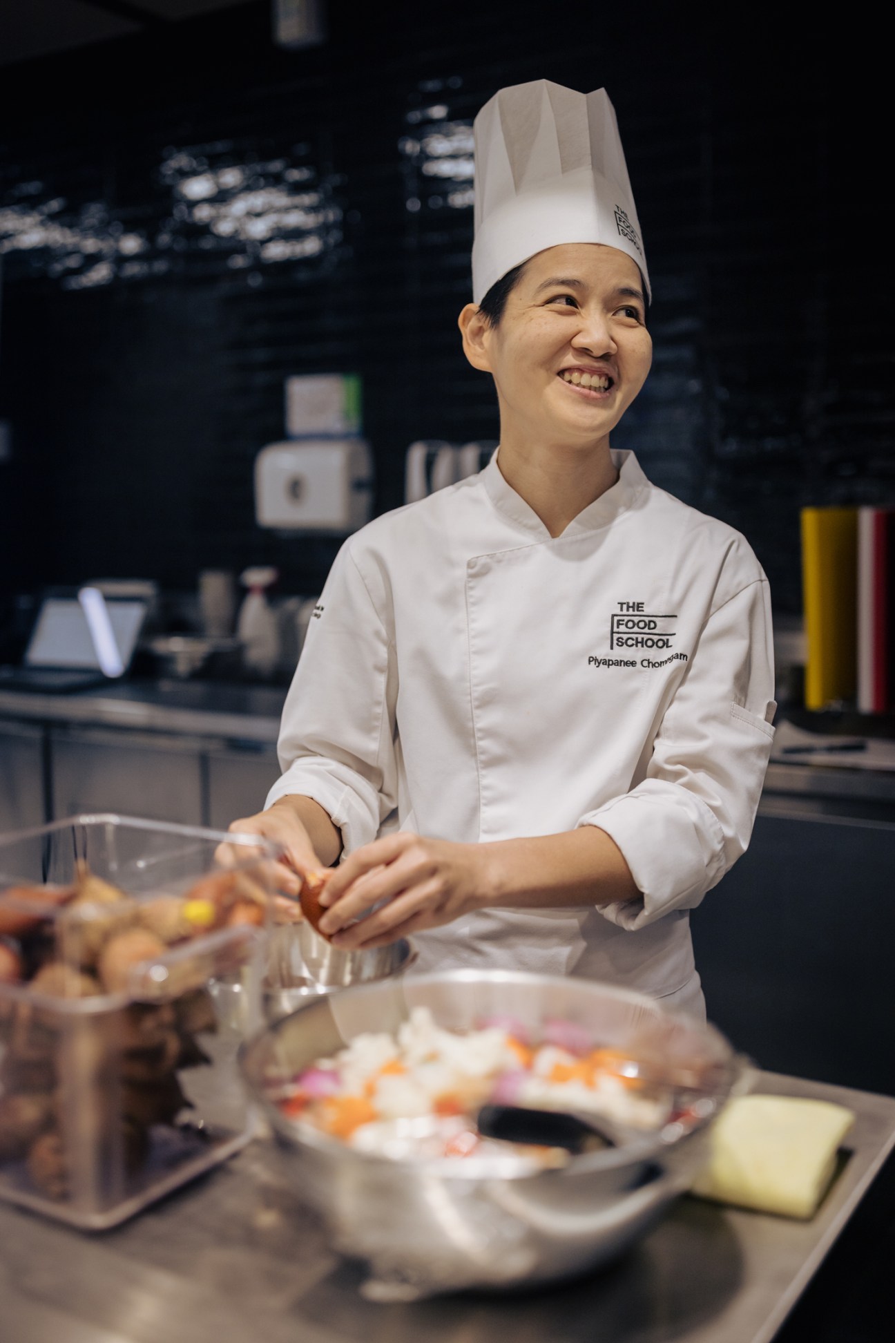 Chef Piyapanee Chombhaim instructs students in The Food School's kitchen in Bangkok.