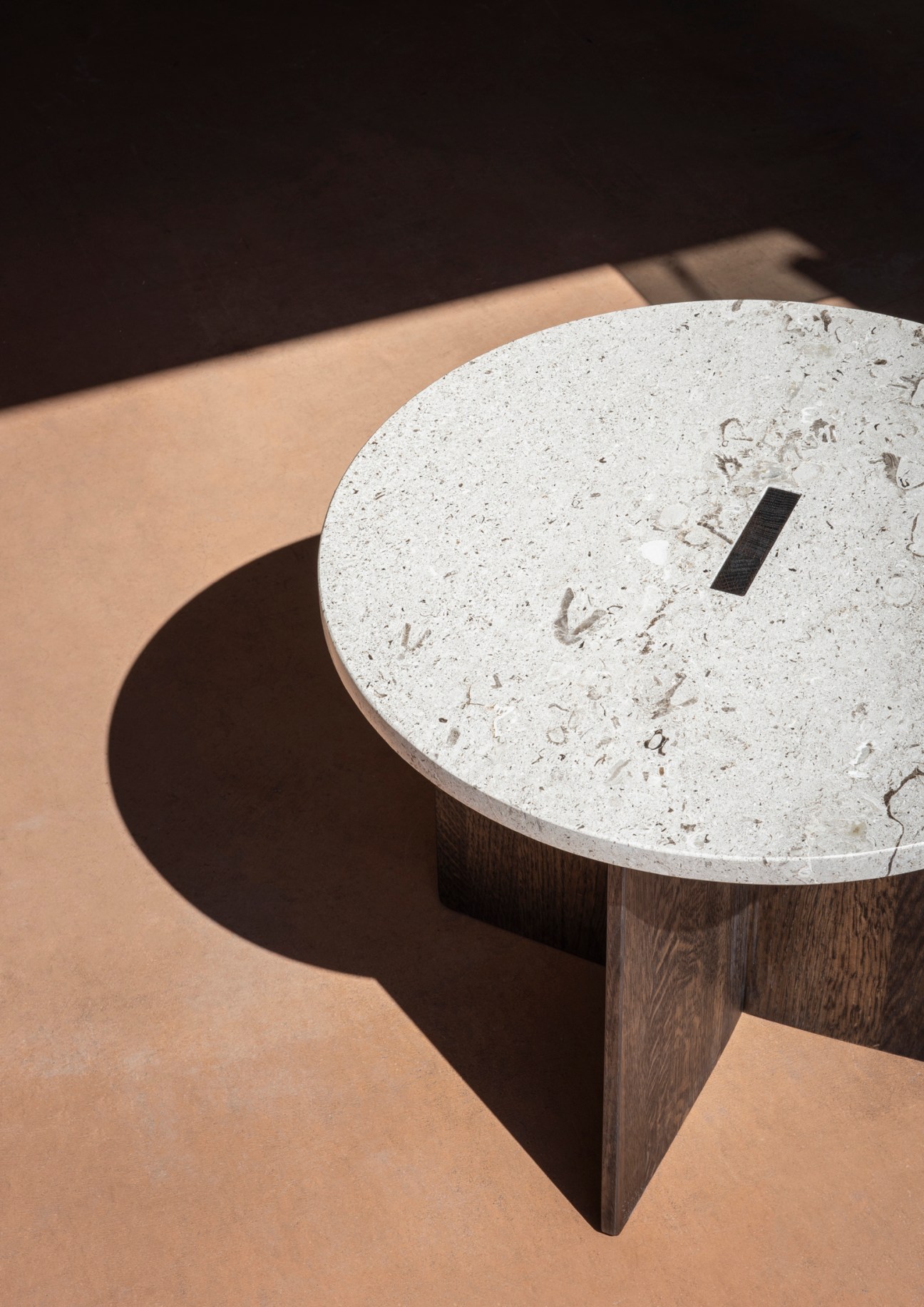 Kinuta N-ST01 side table by Karimoku Case Study with dark timber base and light marble top.