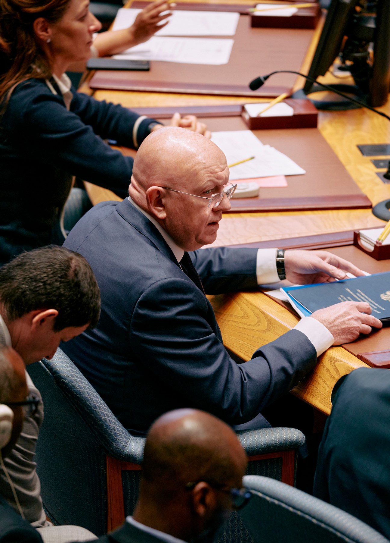 Russia's UN ambassador Vasily Nebenzya seated at the Security Council chamber desk during debate.