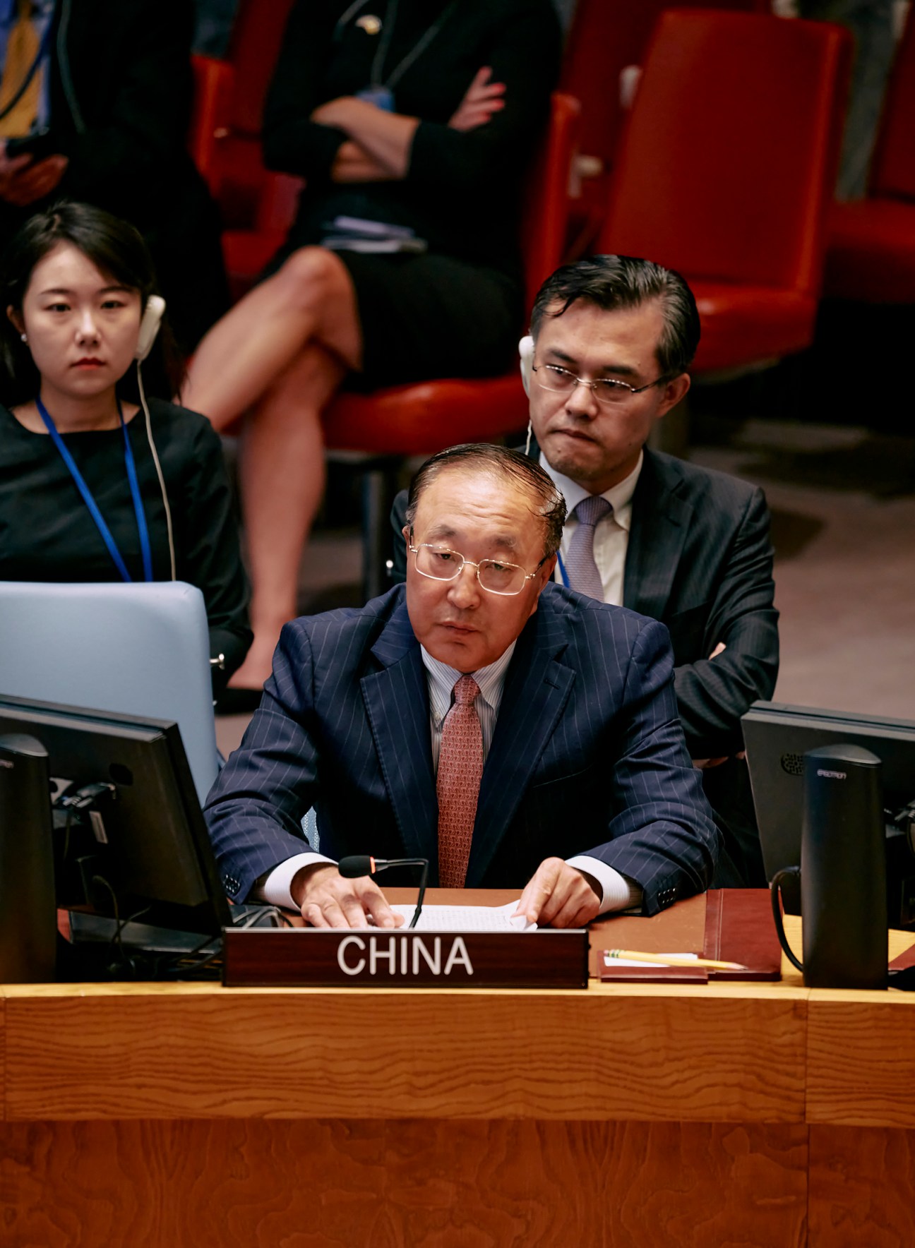 Chinese ambassador Zhang Jun seated at the UN Security Council chamber desk during a meeting.