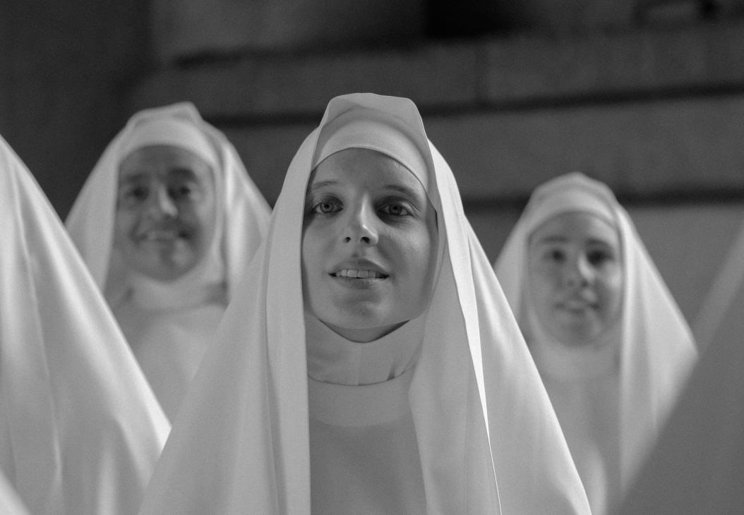Black and white film still showing nuns