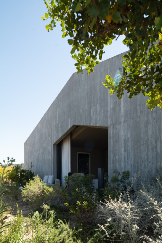 Villa architecture embedded seamlessly into natural landscape