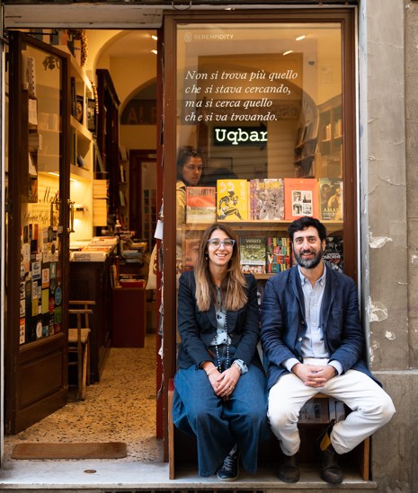 Maddalena Fossombroni and Pietro Torrigiani sitting in the doorway of Todo Modo bookshop