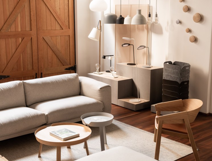 Wooden shelving unit displaying curated homeware, ceramics, kitchen utensils and decorative objects.