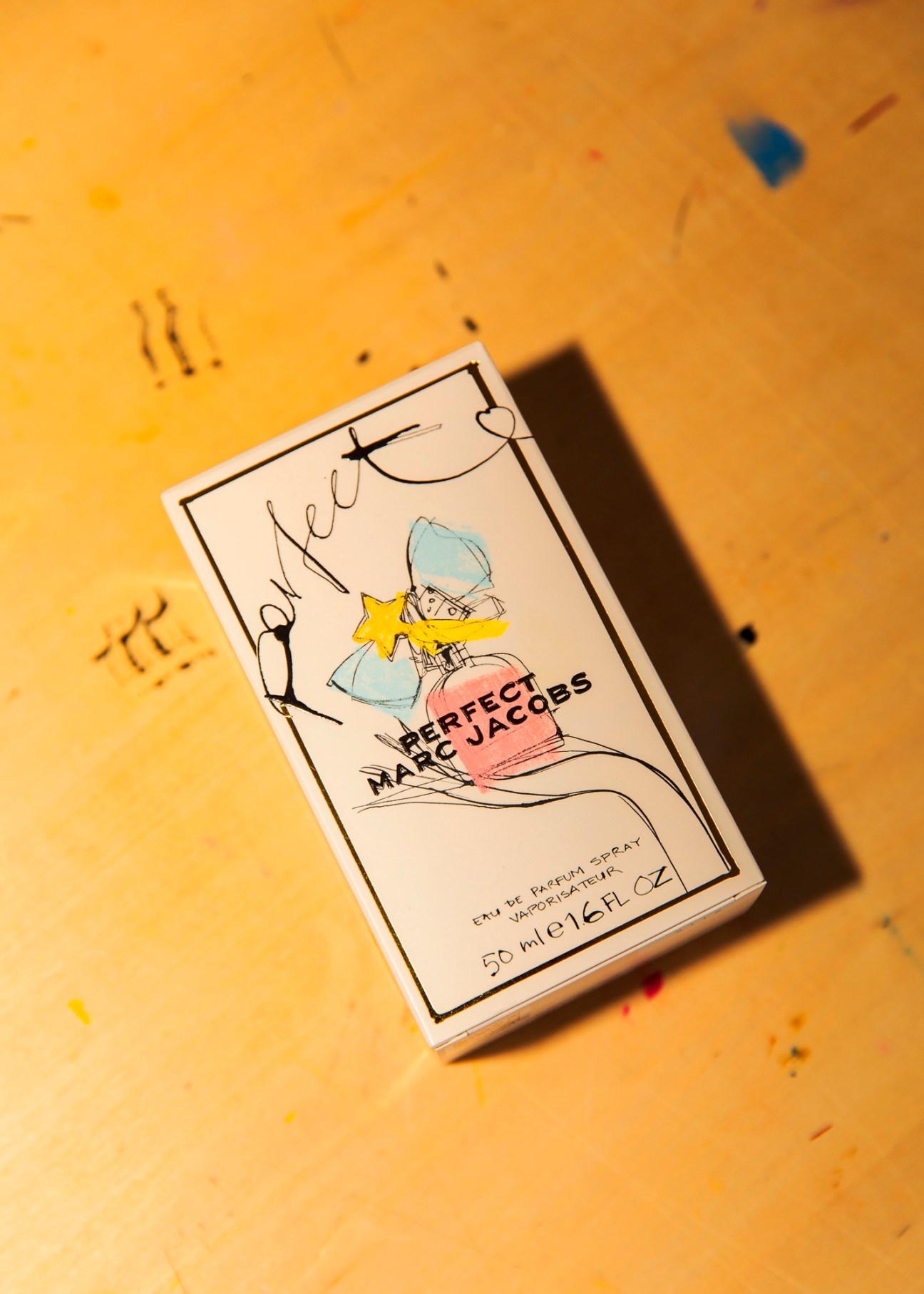 Marc Jacobs Perfect perfume box with illustrated packaging design featuring a figure with blue hair and yellow star