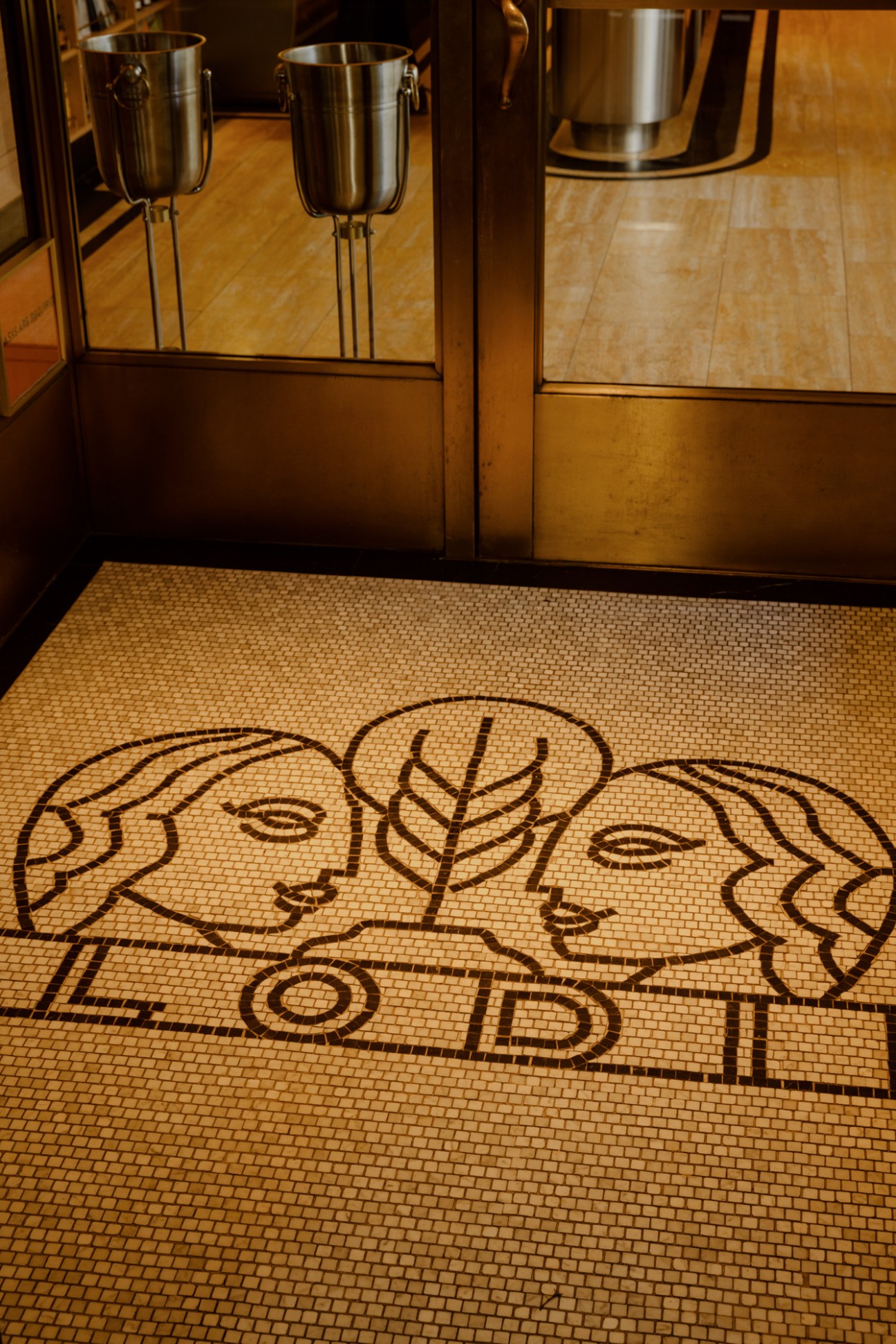 Mosaic floor featuring Lodi's logo with two fish designs and text