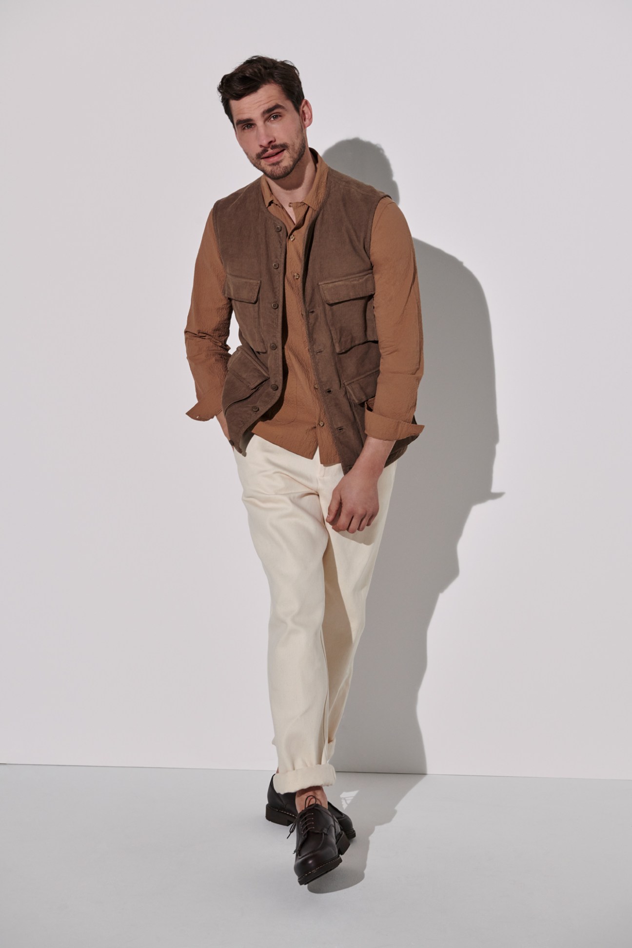 Man in brown vest and shirt by Kestin with jeans by De Bonne Facture and Paraboot shoes