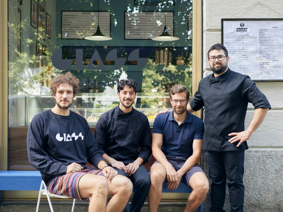 Four men from Giass gelateria team posing outside their Milan shop storefront
